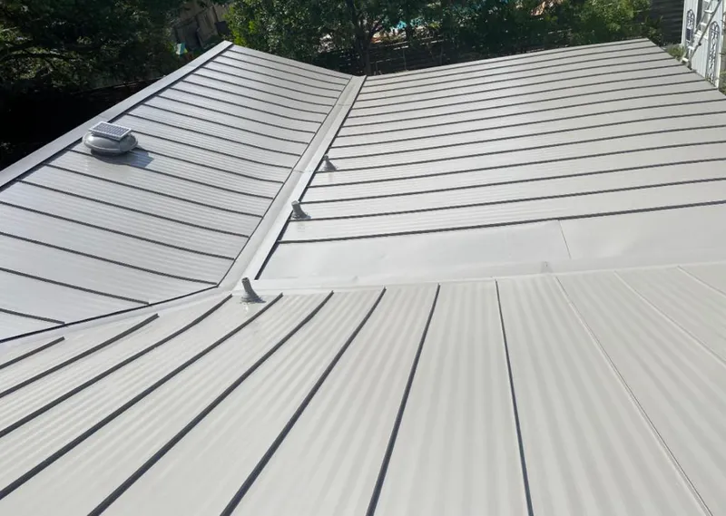 Solar attic fan installed on a metal roof for Roof Ventilation in Tega Cay